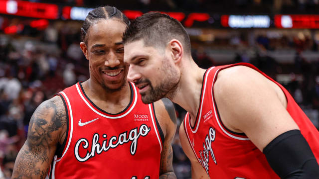 Chicago Bulls center Nikola Vucevic celebrates with forward DeMar DeRozan